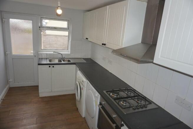 A bright and tidy kitchenette with modern appli...
