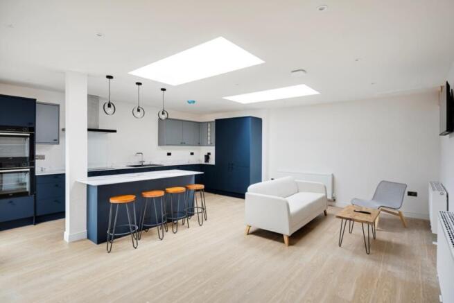 A modern kitchen with a spacious layout and goo...