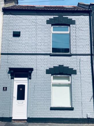 A charming and well-maintained exterior of a pr...