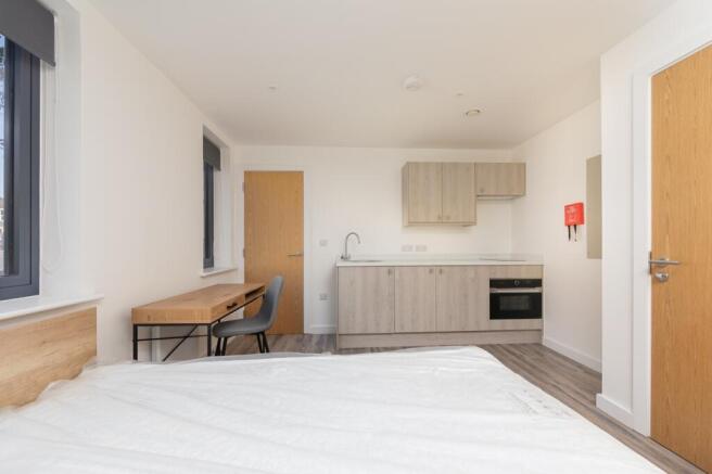 A modern kitchenette with ample storage, perfec...