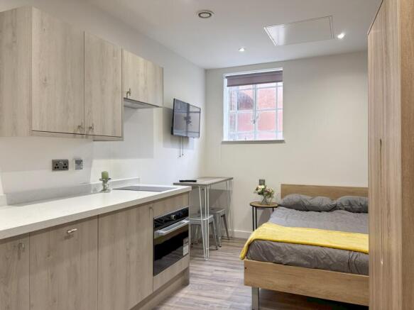 A modern and inviting double bedroom with ample...