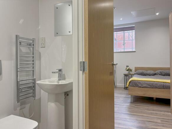 A stylish and clean double bedroom featuring mo...
