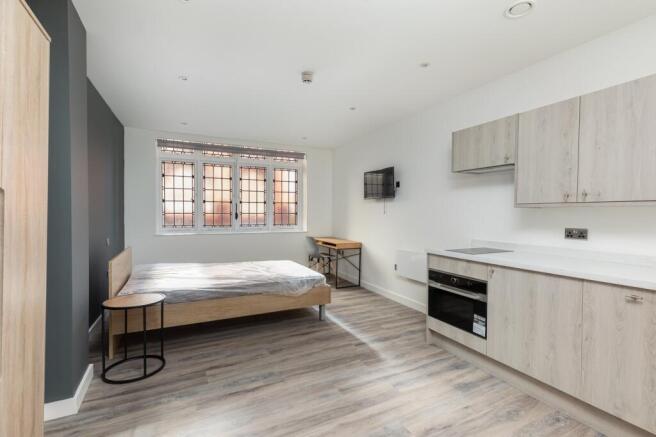 A stylish and spacious double bedroom featuring...