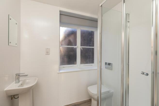 A bright and modern bathroom featuring a sleek ...