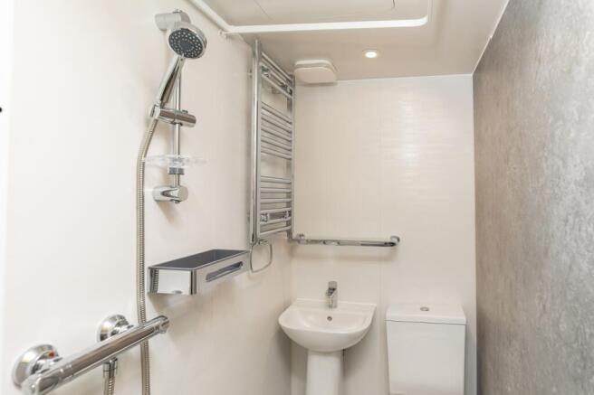 A modern and clean bathroom featuring contempor...