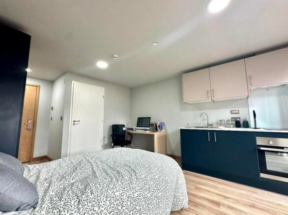 A spacious and modern double bedroom featuring ...