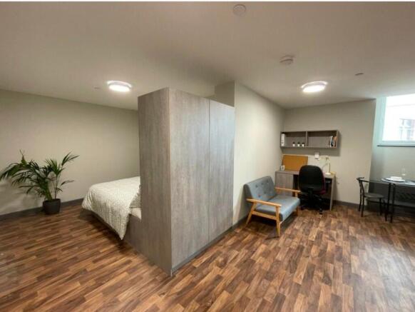 A spacious and well-lit large double bedroom, f...