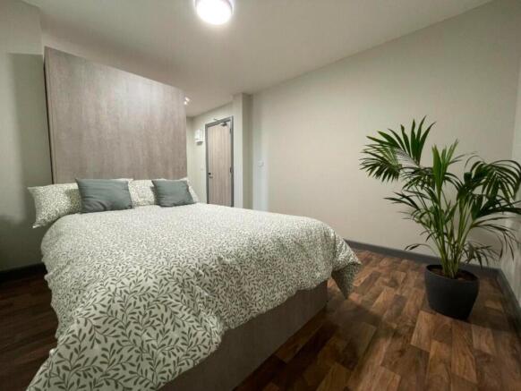 A spacious and inviting large double bedroom, p...