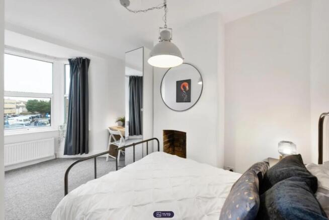 A spacious and stylish large double bedroom wit...