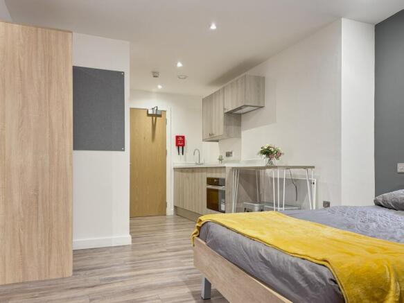 A spacious and well-lit large double bedroom wi...