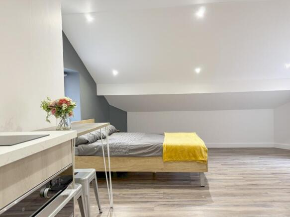 A spacious and bright double bedroom, perfect f...