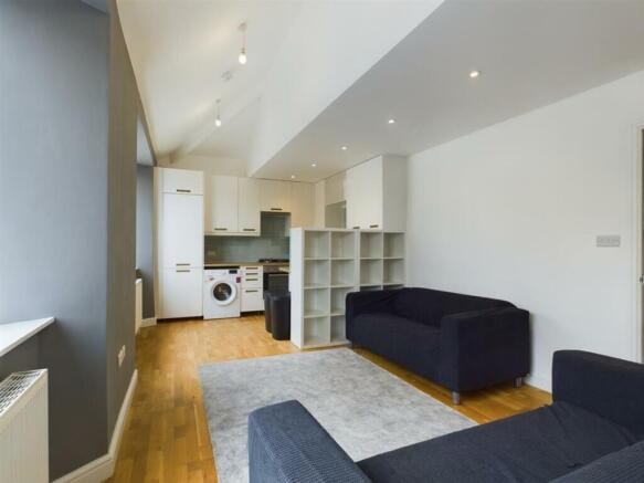 A spacious and modern living room with ample na...