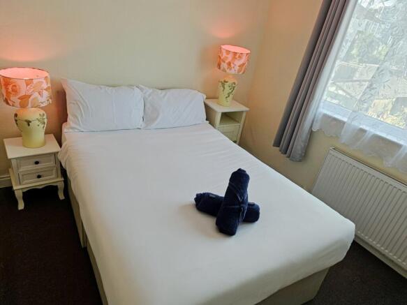 A bright and inviting double bedroom, perfect f...
