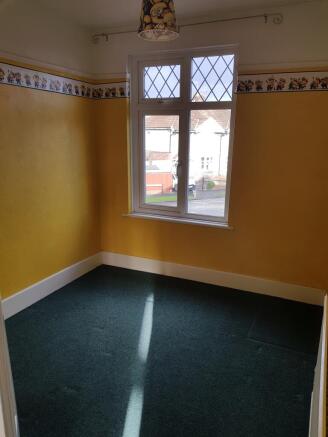 A bright and welcoming double bedroom with chee...