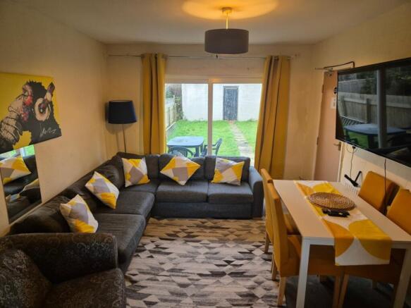 A spacious and inviting modern living room with...
