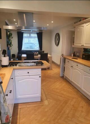 A spacious and bright kitchen featuring modern ...
