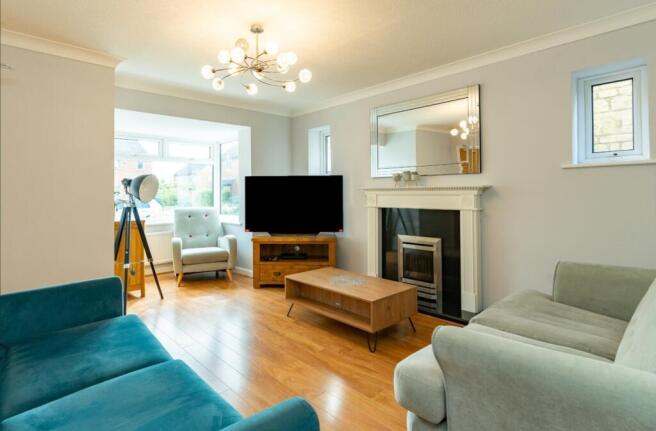 A spacious and stylish modern living room, perf...