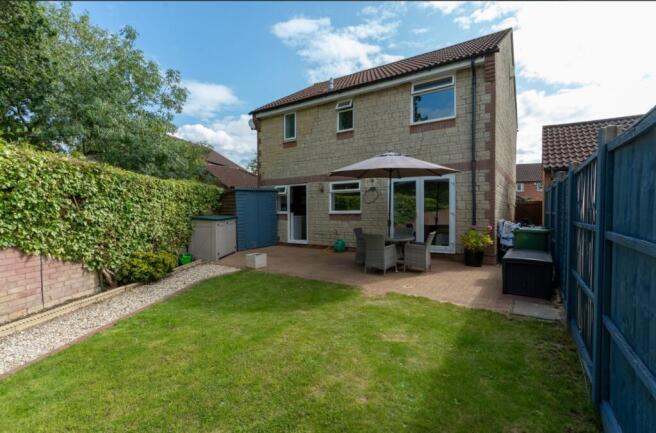 A spacious and well-maintained garden with plen...