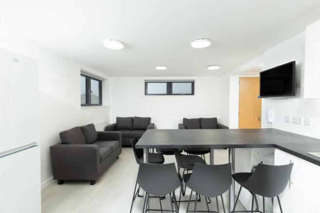A spacious and modern living room with ample na...