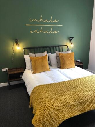 A stylish and inviting double bedroom featuring...
