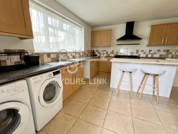 A bright and modern kitchen equipped with essen...