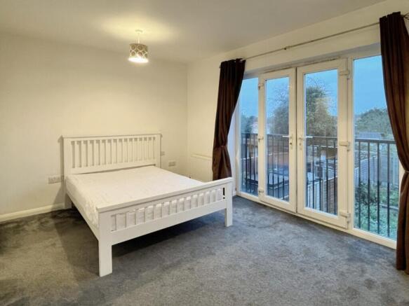 A spacious and inviting large double bedroom wi...