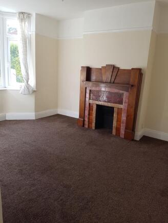 A spacious living room featuring a charming fir...