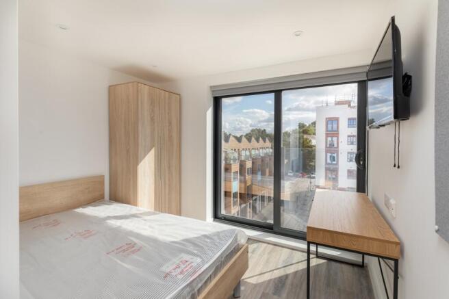 A bright and inviting double bedroom perfect fo...
