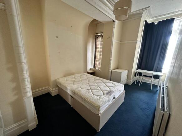 A spacious and bright double bedroom with ample...
