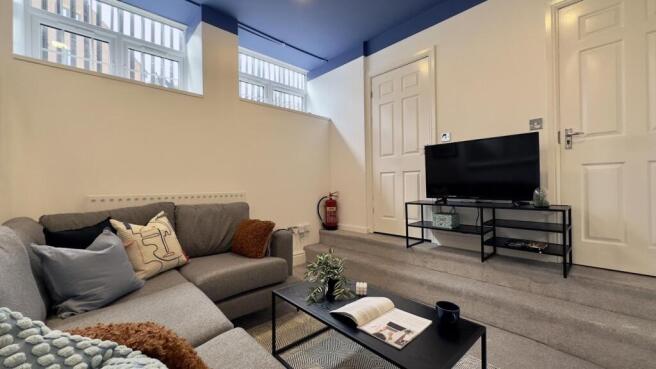 A spacious and inviting large modern living roo...