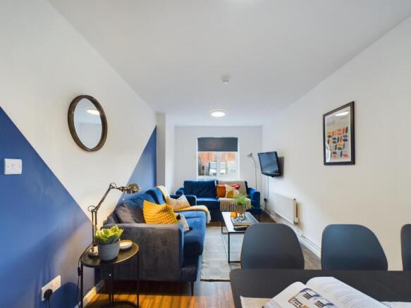 A spacious and stylish living room with modern ...