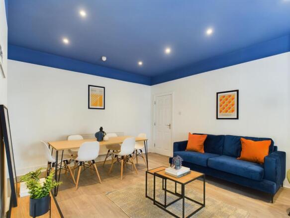 A spacious and modern living room, ideal for so...