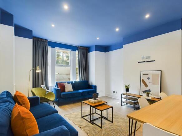 A spacious and stylish modern living room with ...