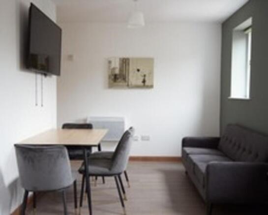 A modern and inviting living room featuring sty...