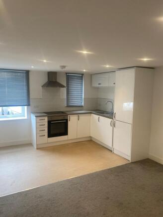A modern kitchenette with clean lines and ample...