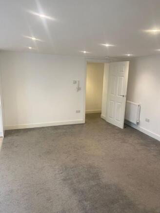 A spacious and bright living room perfect for s...