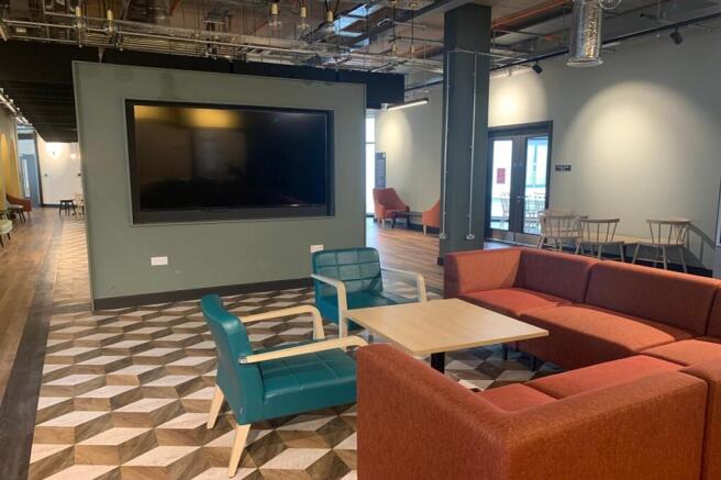 A spacious and inviting communal lounge with a ...