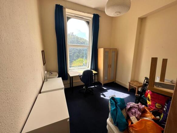 A bright and spacious double bedroom with ample...