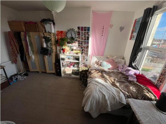 A cozy double bedroom filled with natural light...