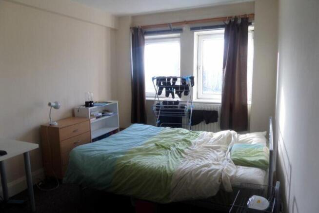 A spacious and bright double bedroom with ample...
