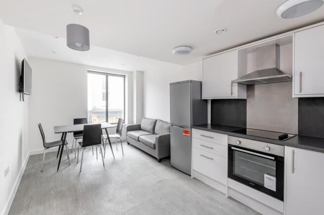 A modern and bright kitchenette with stylish ap...