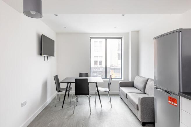 A bright and modern living room with ample spac...