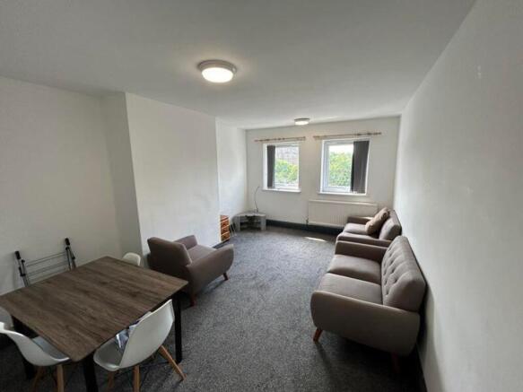 A spacious and inviting large modern living roo...