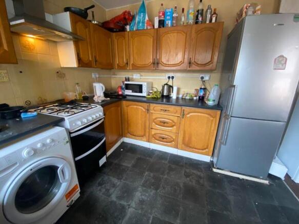 A functional kitchenette featuring essential ap...