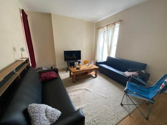A spacious and inviting modern living room with...