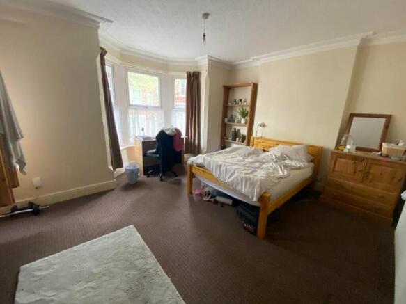 A spacious and inviting double bedroom filled w...