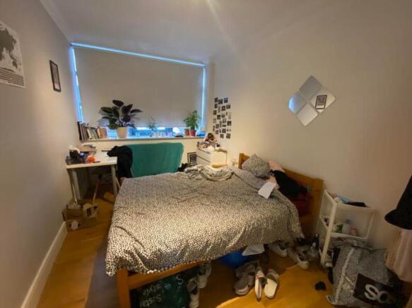 A spacious double bedroom with good natural lig...