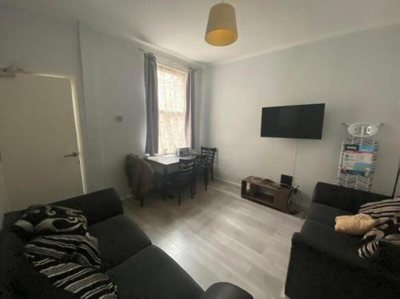 A spacious and inviting modern living room with...