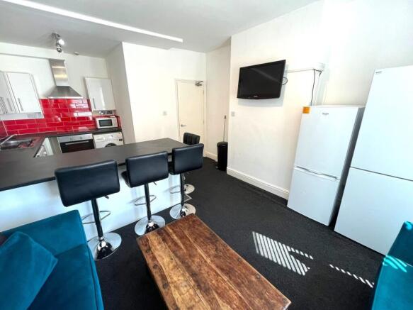 A spacious and modern living room with stylish ...