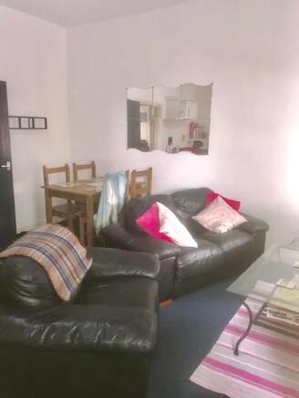 A cozy living room with inviting seating, perfe...